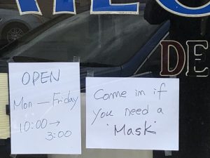 Signs in Raleigh, come in if you need a mask
