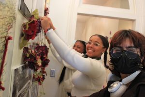 Students in Dr. Antonia Randolph's course install the Black Feminisms Exhibit at Love House and Hutchins Forum.